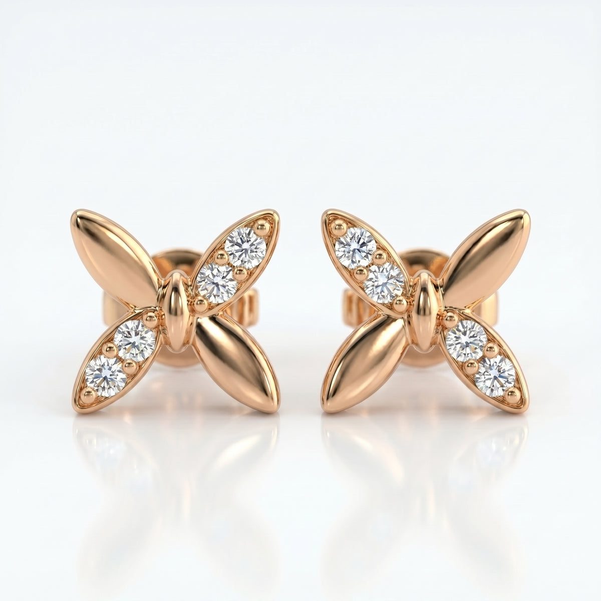 Luxury butterfly diamond stud earrings at 45-degree angle showing polished gold finish and sparkling stones