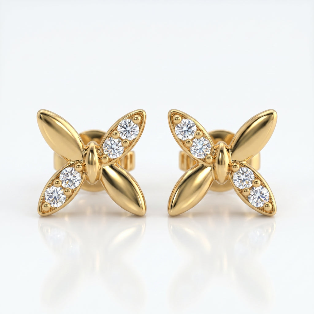 Flat lay butterfly diamond earrings styled with elegant luxury accessories on a clean white background