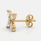 Luxury butterfly diamond stud earrings in gold with marquise-cut stones on a clean white background