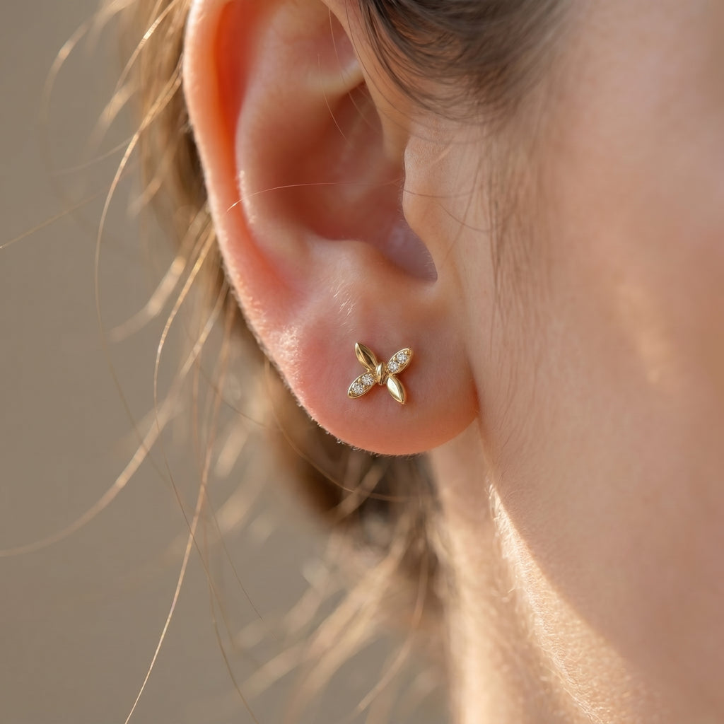 Side profile of butterfly diamond stud earrings highlighting secure setting and premium fine jewelry craftsmanship