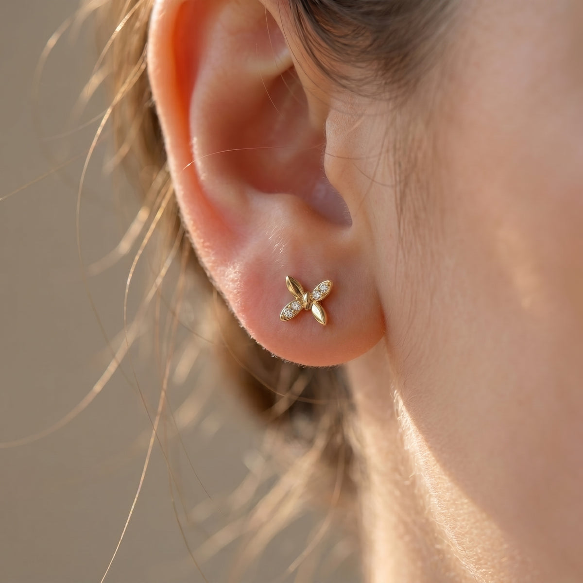 Side profile of butterfly diamond stud earrings highlighting secure setting and premium fine jewelry craftsmanship