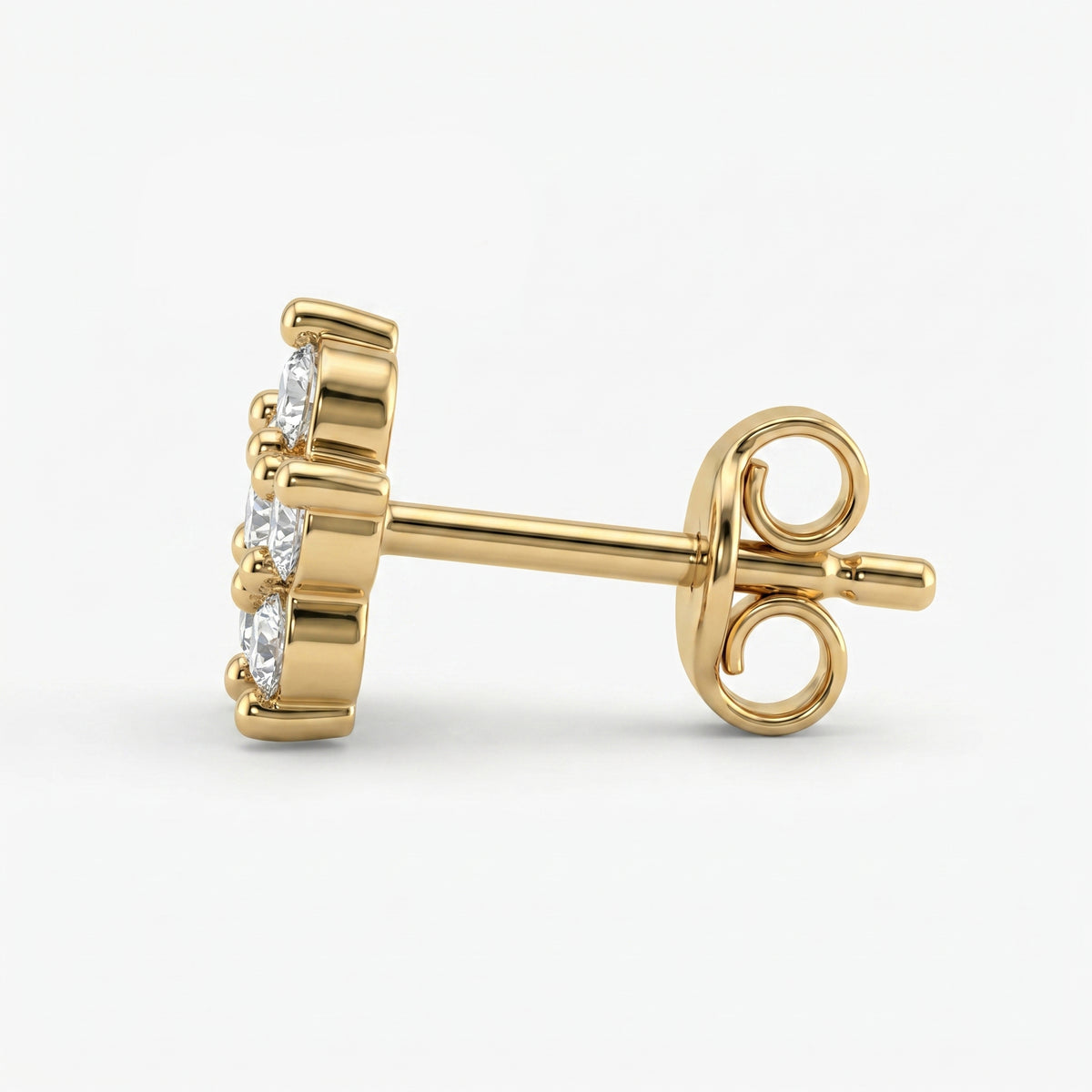 Macro close-up of floral diamond earrings highlighting brilliant sparkle and fine gold detailing