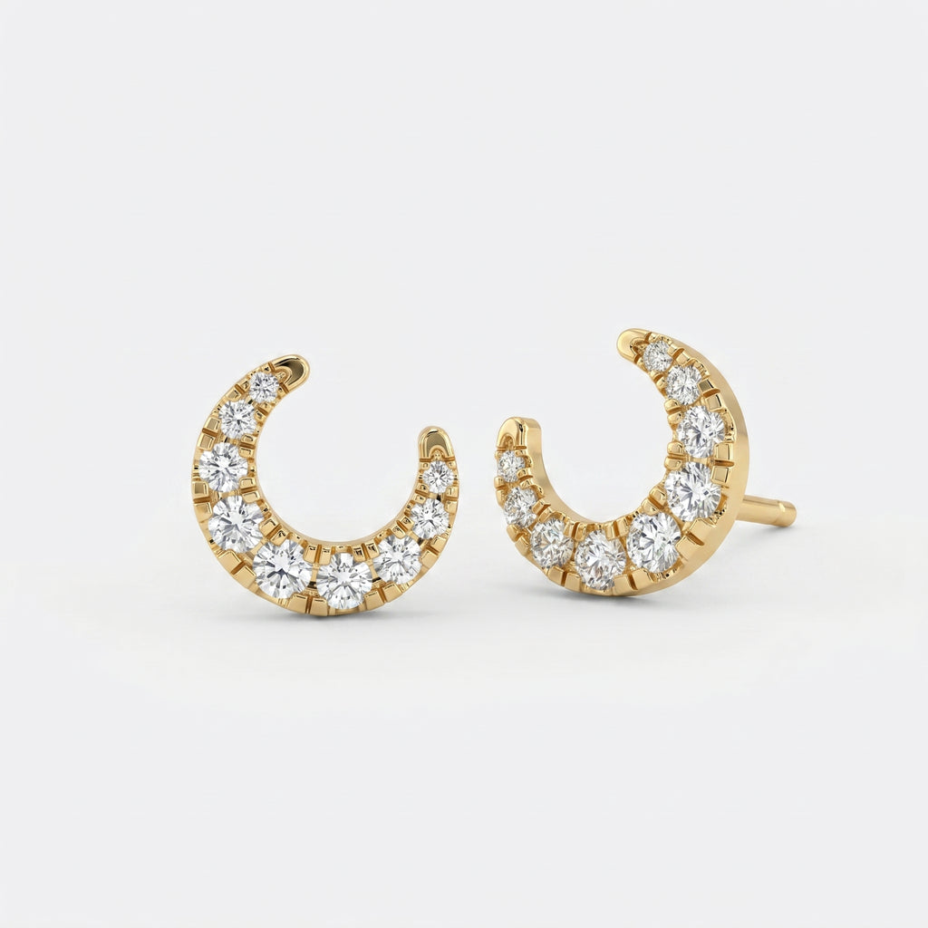 Side profile of yellow gold crescent diamond earrings showing premium pavé craftsmanship details