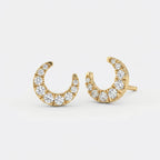 Side profile of yellow gold crescent diamond earrings showing premium pavé craftsmanship details