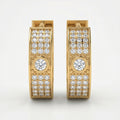 Side profile of pavé diamond hoop earrings with polished rose gold finish and secure huggie clasp