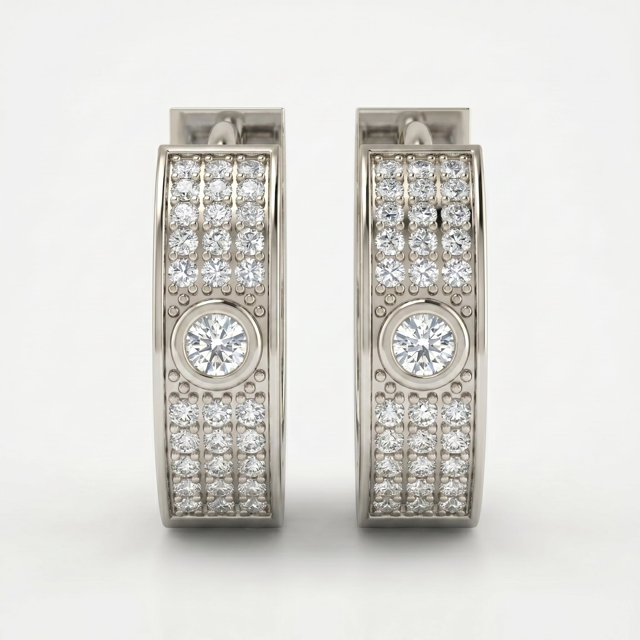 Luxury diamond huggie hoop earrings in rose gold with pavé detailing shown at elegant 45-degree angle