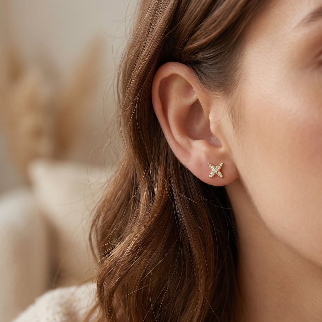 Macro close-up of pavé diamond star earrings showing brilliant-cut stones and detailed prong craftsmanship