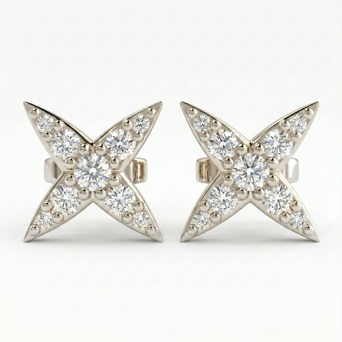 White gold diamond star stud earrings with pavé round diamonds on clean white background for luxury jewelry styling