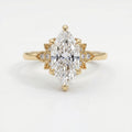 dutch-Marquise diamond engagement ring in yellow gold with floral side accents and pavé diamonds, luxury bridal jewelry