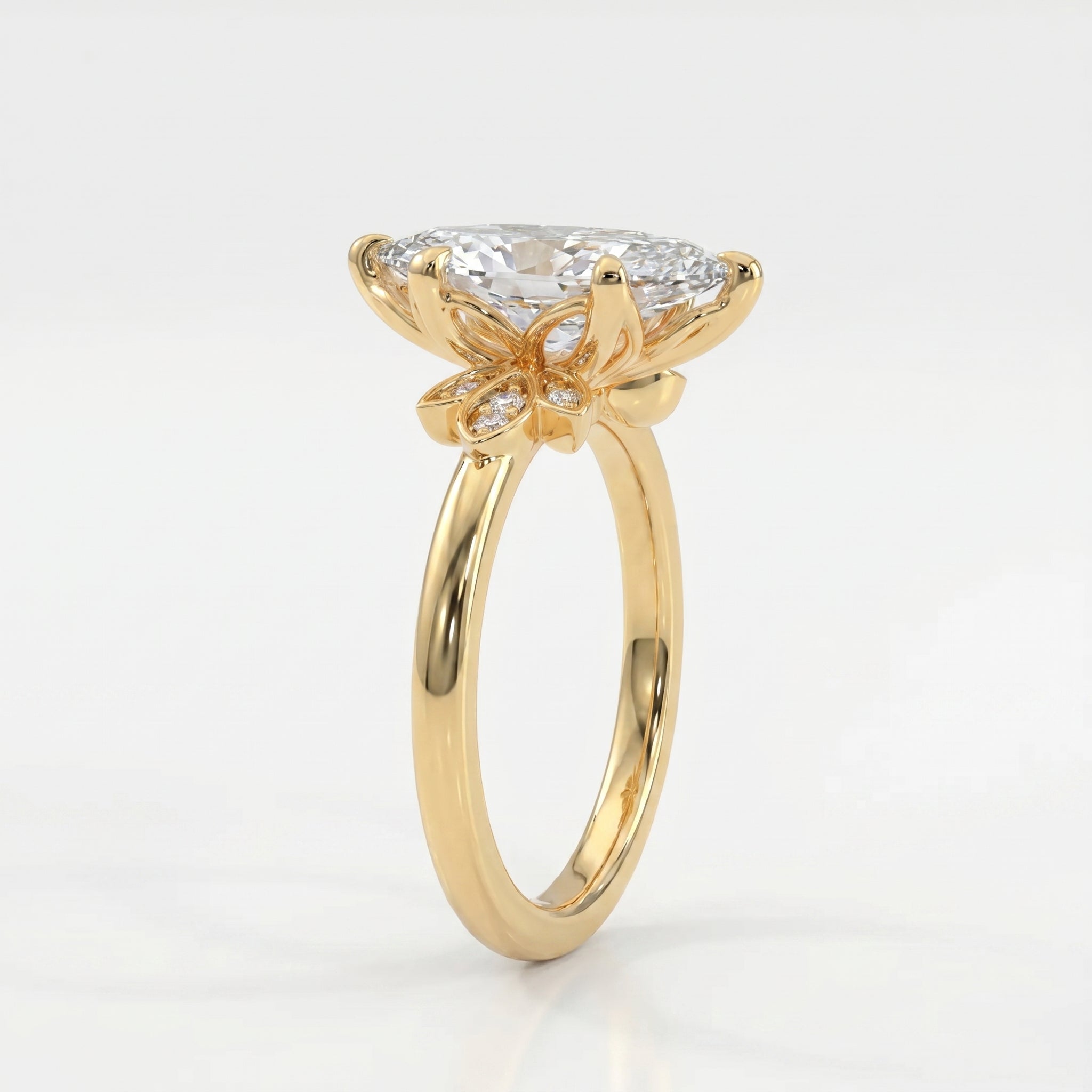 45 degree view of marquise diamond engagement ring featuring yellow gold floral setting and brilliant accent stones