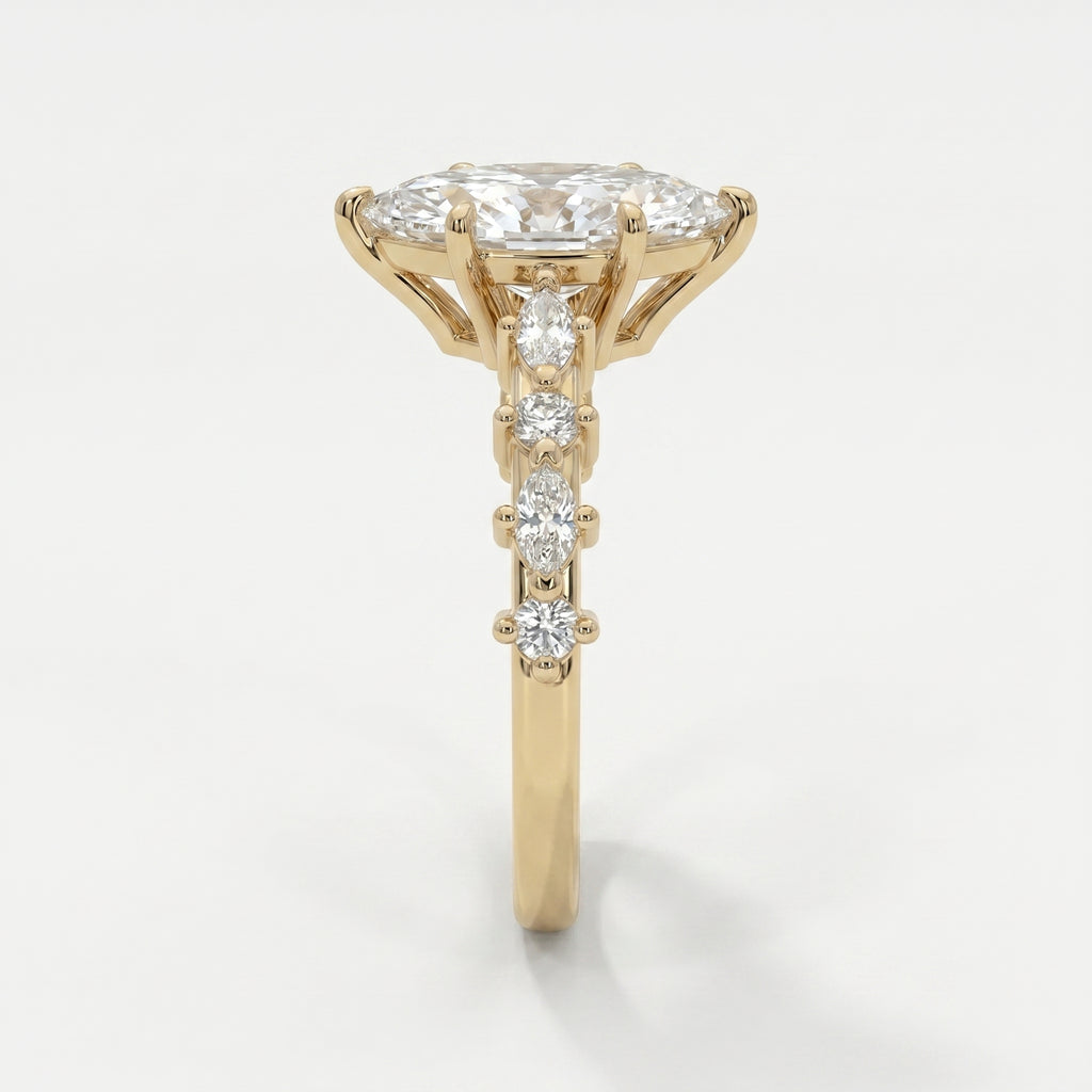 Side profile of yellow gold marquise diamond engagement ring showcasing elevated prong and gallery design
