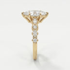 Side profile of yellow gold marquise diamond engagement ring showcasing elevated prong and gallery design