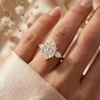 Marquise three stone diamond engagement ring worn on hand showing elegant proportions and brilliance