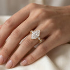 Marquise diamond engagement ring worn on hand showcasing size, sparkle and elegant bridal styling