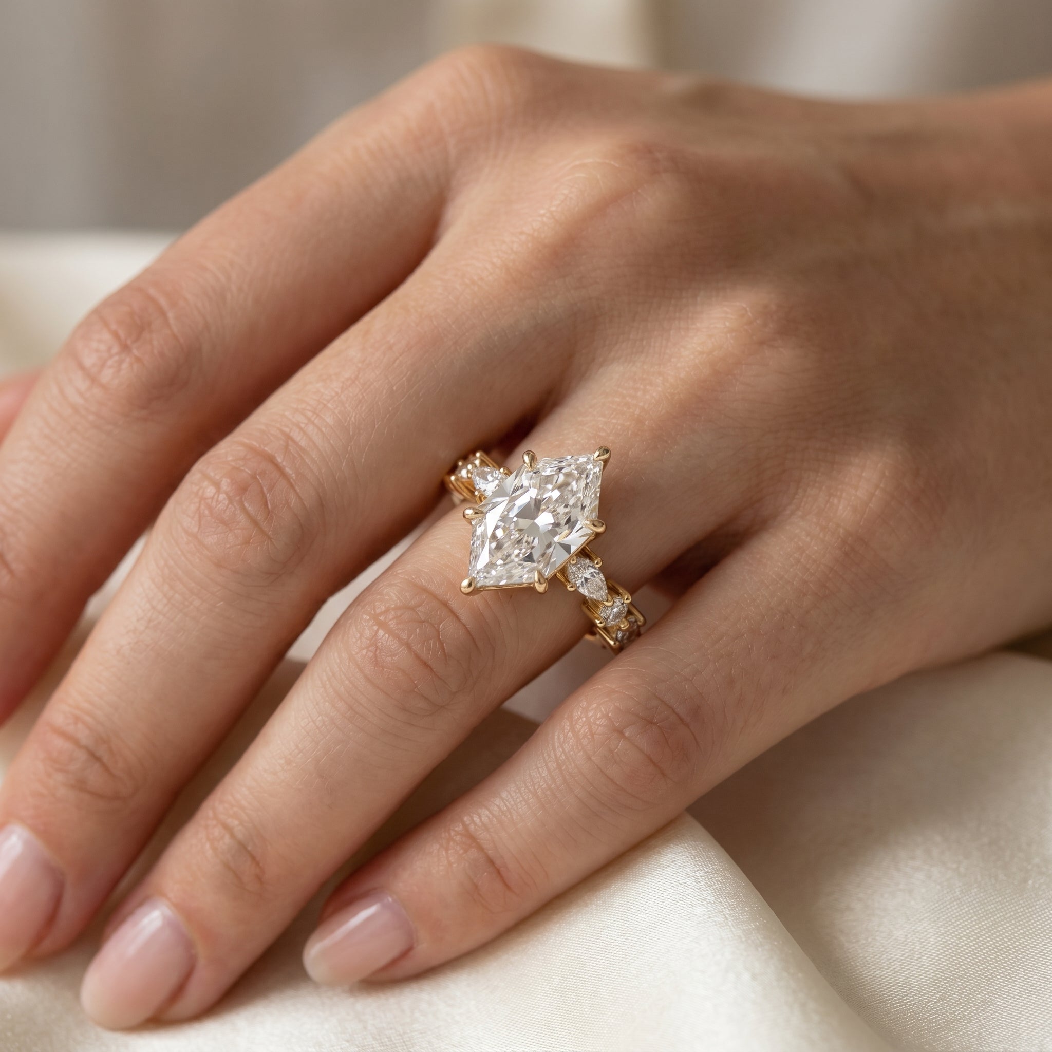 Marquise diamond engagement ring worn on hand showcasing size, sparkle and elegant bridal styling