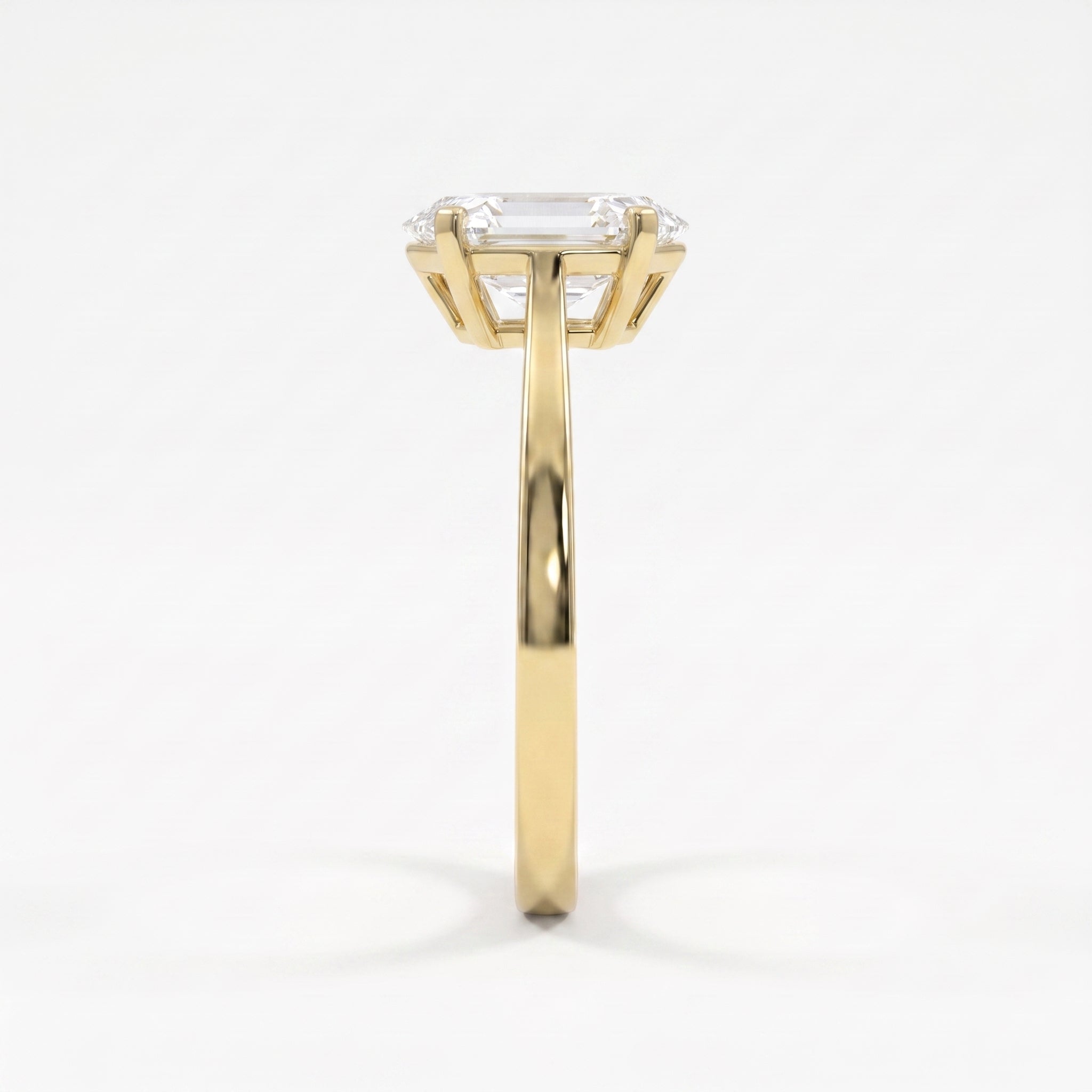 Side profile of an elongated hexagon diamond solitaire engagement ring highlighting the elegant four-prong cathedral setting.