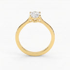 Premium elongated hexagon solitaire engagement ring featuring a step-cut diamond in a sleek four-prong polished gold setting.