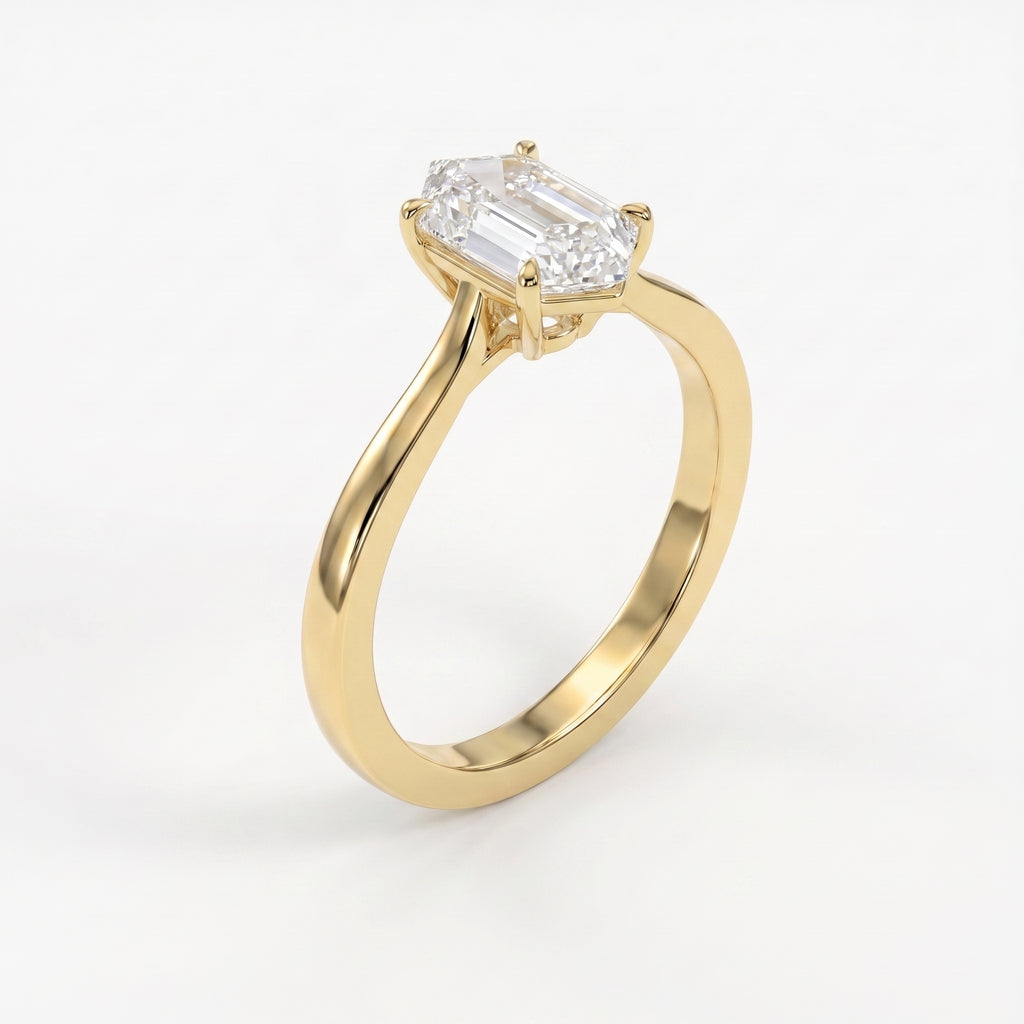 Luxury elongated hexagon step-cut diamond solitaire ring shown from a 45-degree angle with a polished minimalist band.