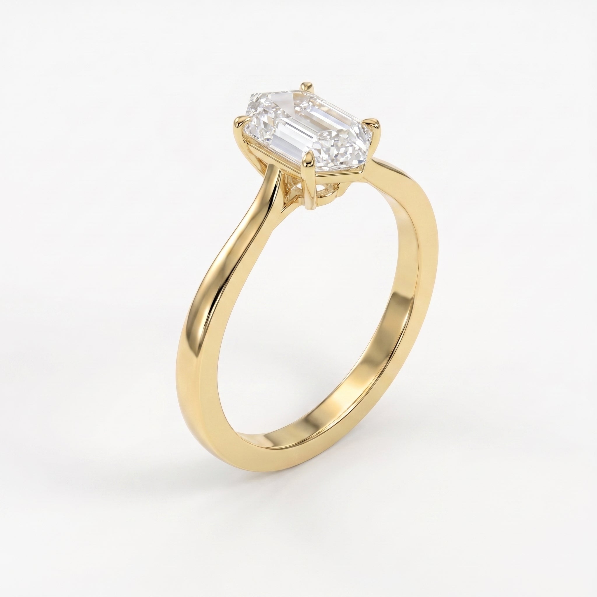 Luxury elongated hexagon step-cut diamond solitaire ring shown from a 45-degree angle with a polished minimalist band.