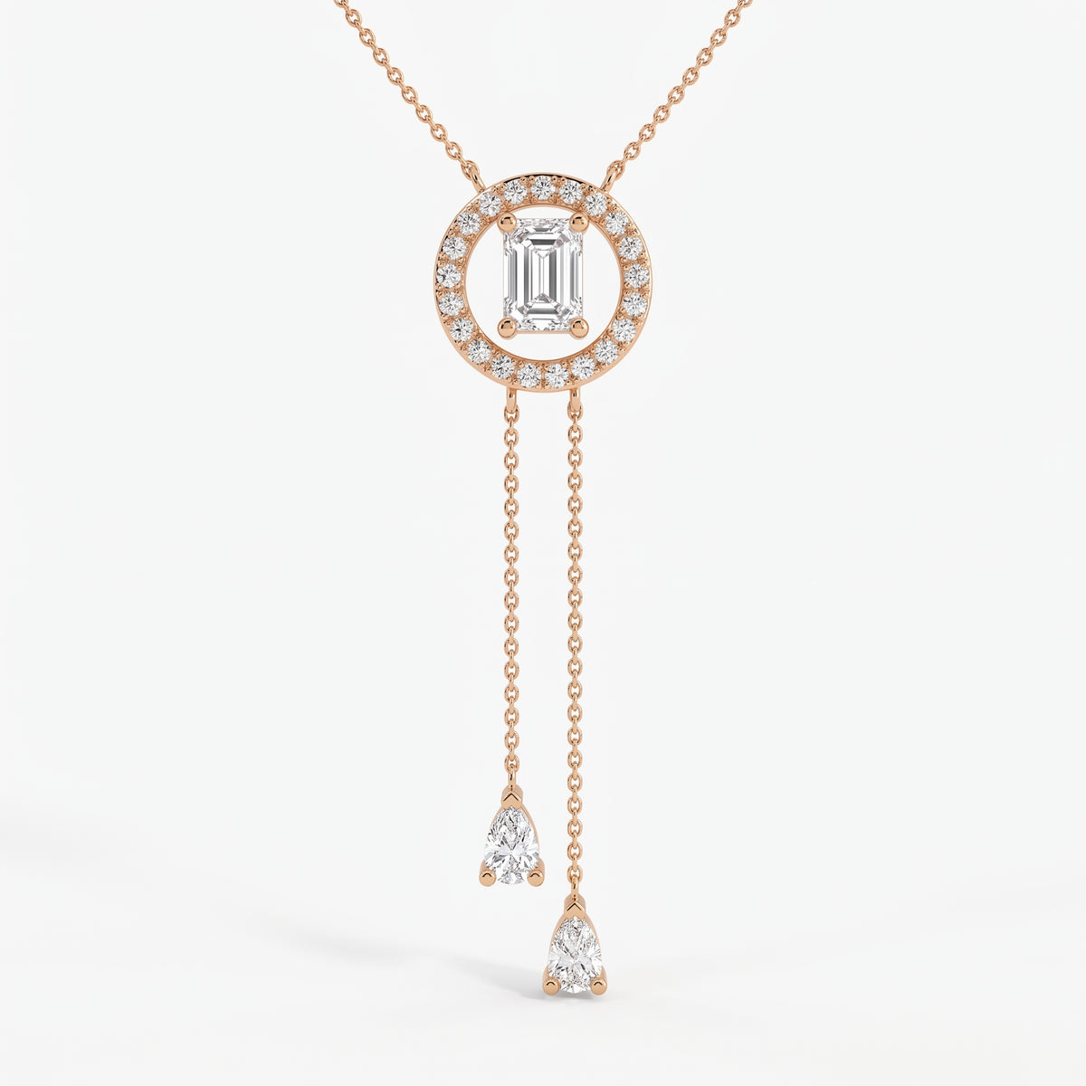 Emerald-cut halo lariat necklace in rose gold with two pear-shaped diamond drop chains