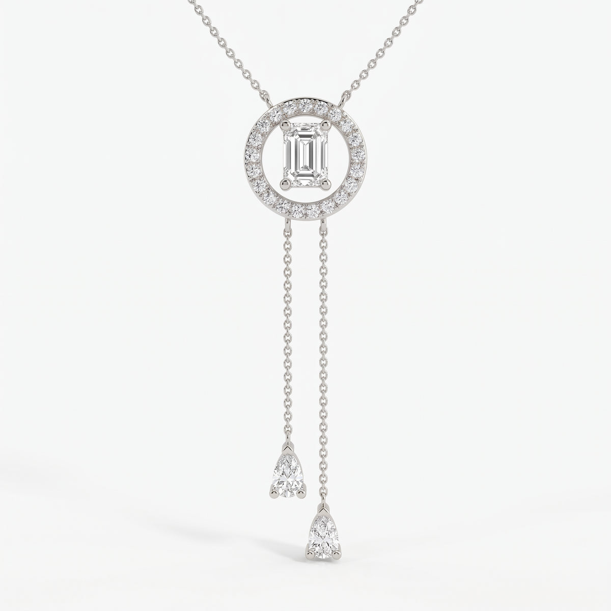 Emerald-cut halo lariat necklace in white gold with two pear-shaped diamond drop chains