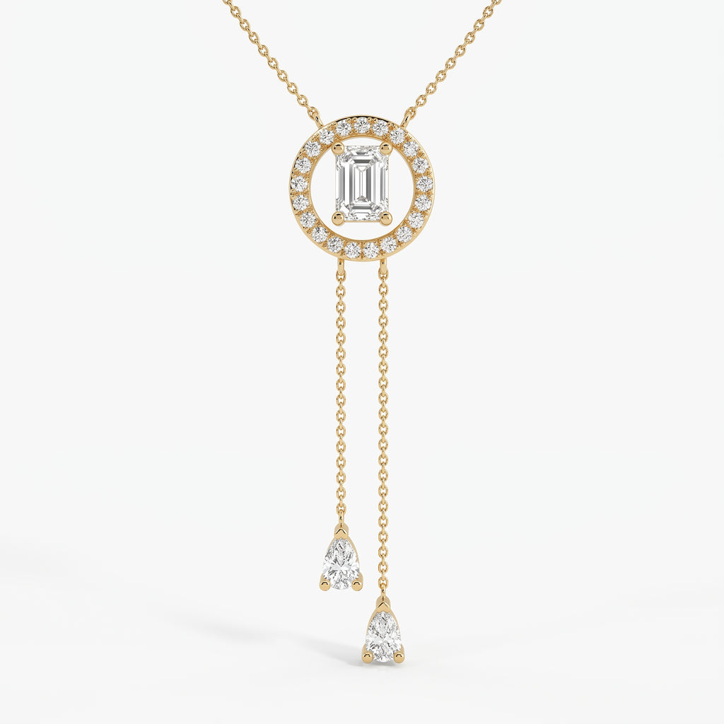 Emerald-cut halo lariat necklace in yellow gold with two pear-shaped diamond drop chains
