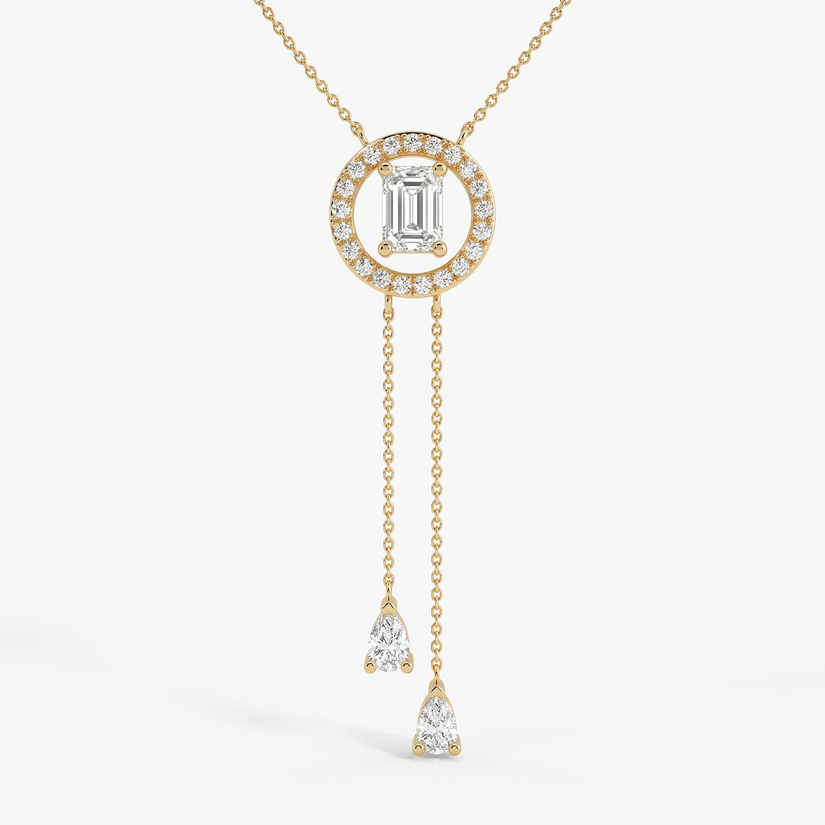 Emerald-cut halo lariat necklace in yellow gold with two pear-shaped diamond drop chains