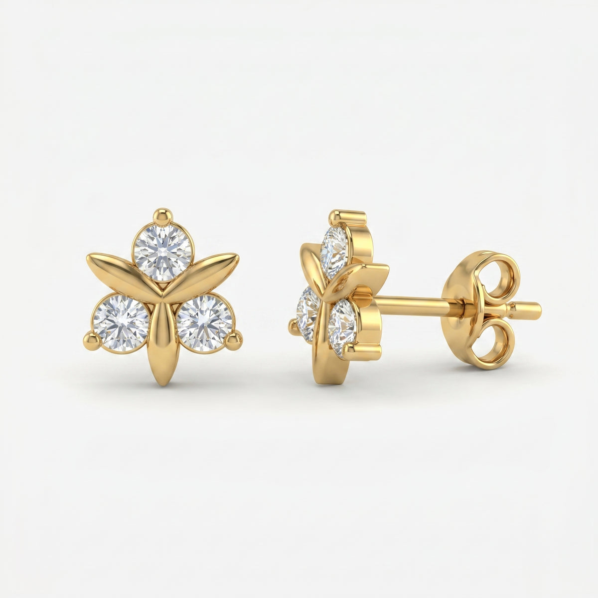 Woman wearing rose gold floral stud earrings with sparkling stones in elegant minimalist lifestyle setting