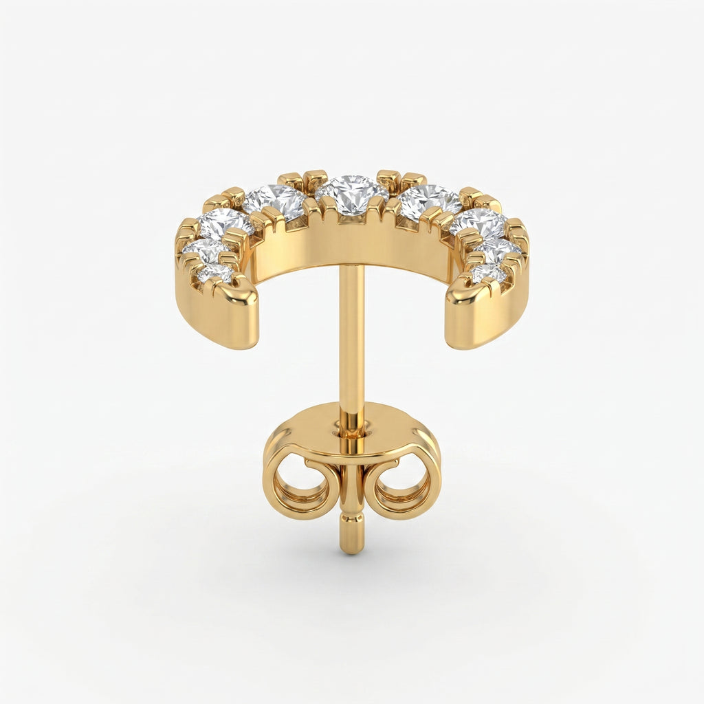 Luxury yellow gold crescent earrings with brilliant pavé diamonds in angled studio product shot
