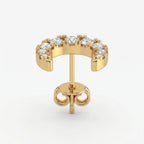 Luxury yellow gold crescent earrings with brilliant pavé diamonds in angled studio product shot