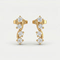 Luxury yellow gold curved stud earrings with four round brilliant stones on a clean white background