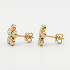 Side profile of yellow gold flower diamond stud earrings with secure butterfly backing and bezel settings