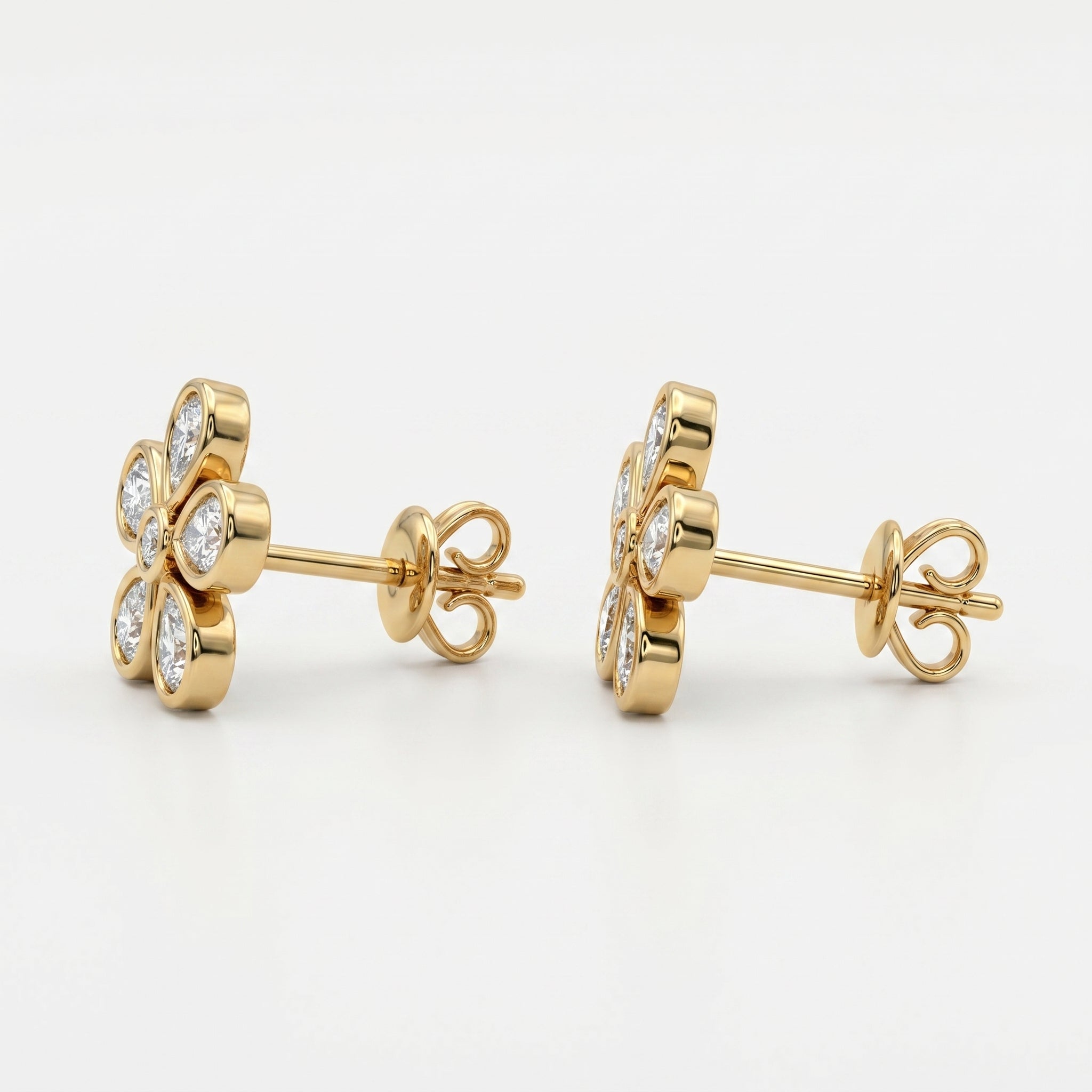Side profile of yellow gold flower diamond stud earrings with secure butterfly backing and bezel settings
