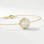 Elegant geometric gold bracelet with hexagon-cut clear stone and fine luxury chain detail