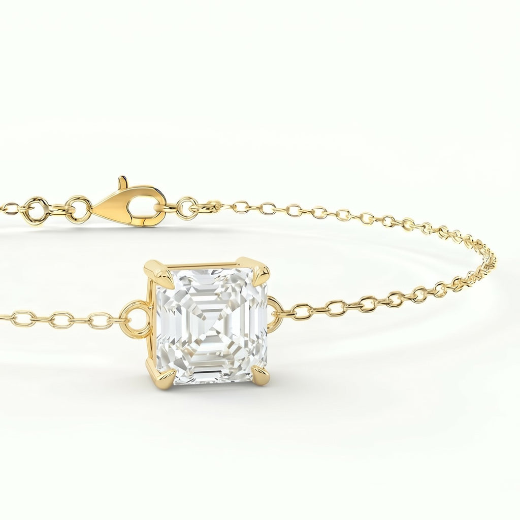 Luxury gold solitaire bracelet with Asscher-cut gemstone shown in elegant 45-degree studio angle