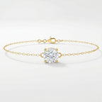 Minimalist yellow gold solitaire chain bracelet with round brilliant stone on clean white background