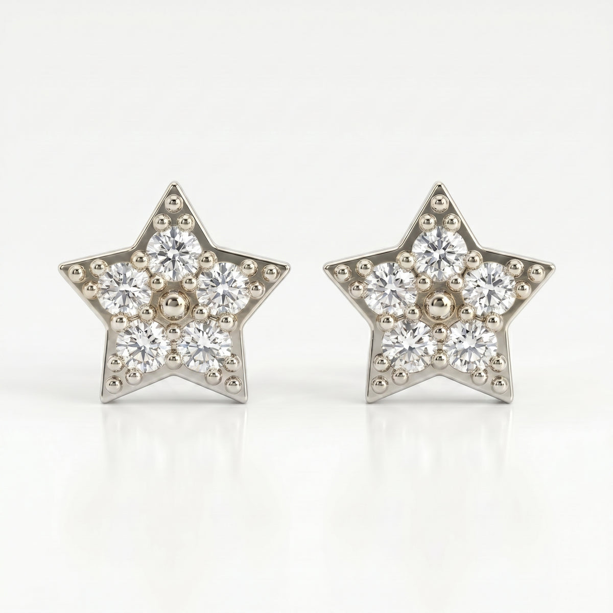 45-degree view of gold star pavé stud earrings with sparkling stones and polished luxury metal finish