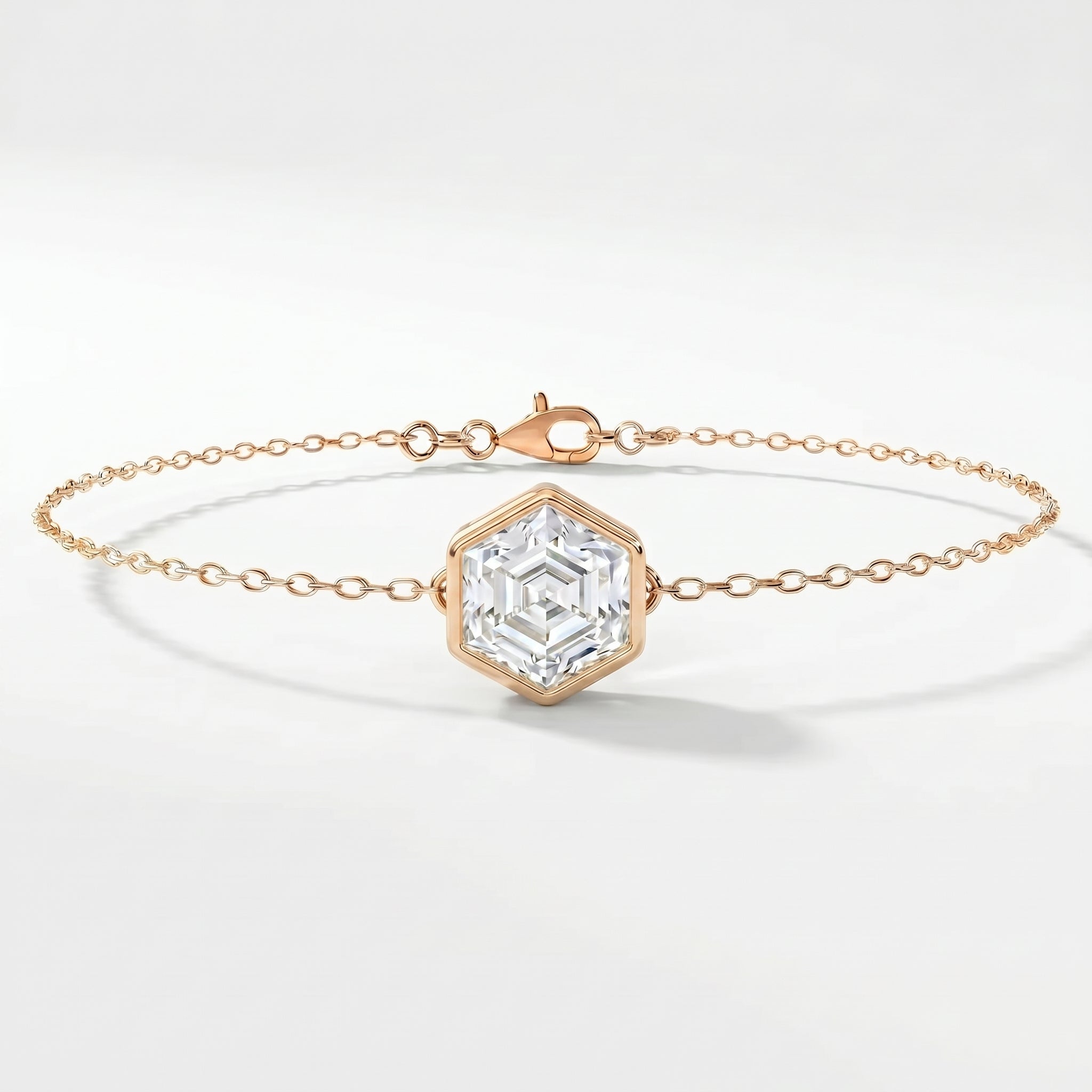 Minimalist hexagon crystal bracelet in rose gold with dainty chain and geometric gemstone centerpiece