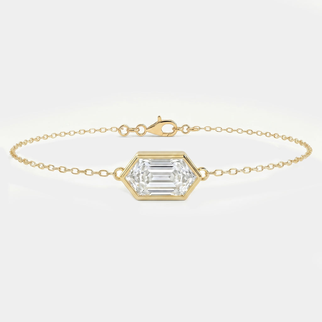 Minimalist gold chain bracelet with hexagon-cut clear gemstone in bezel setting on white background