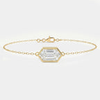 Minimalist gold chain bracelet with hexagon-cut clear gemstone in bezel setting on white background