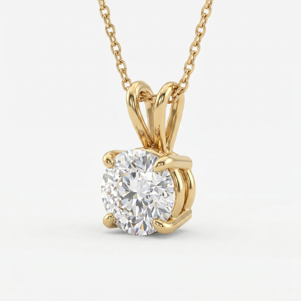Gold necklace with a round diamond pendant on a white background