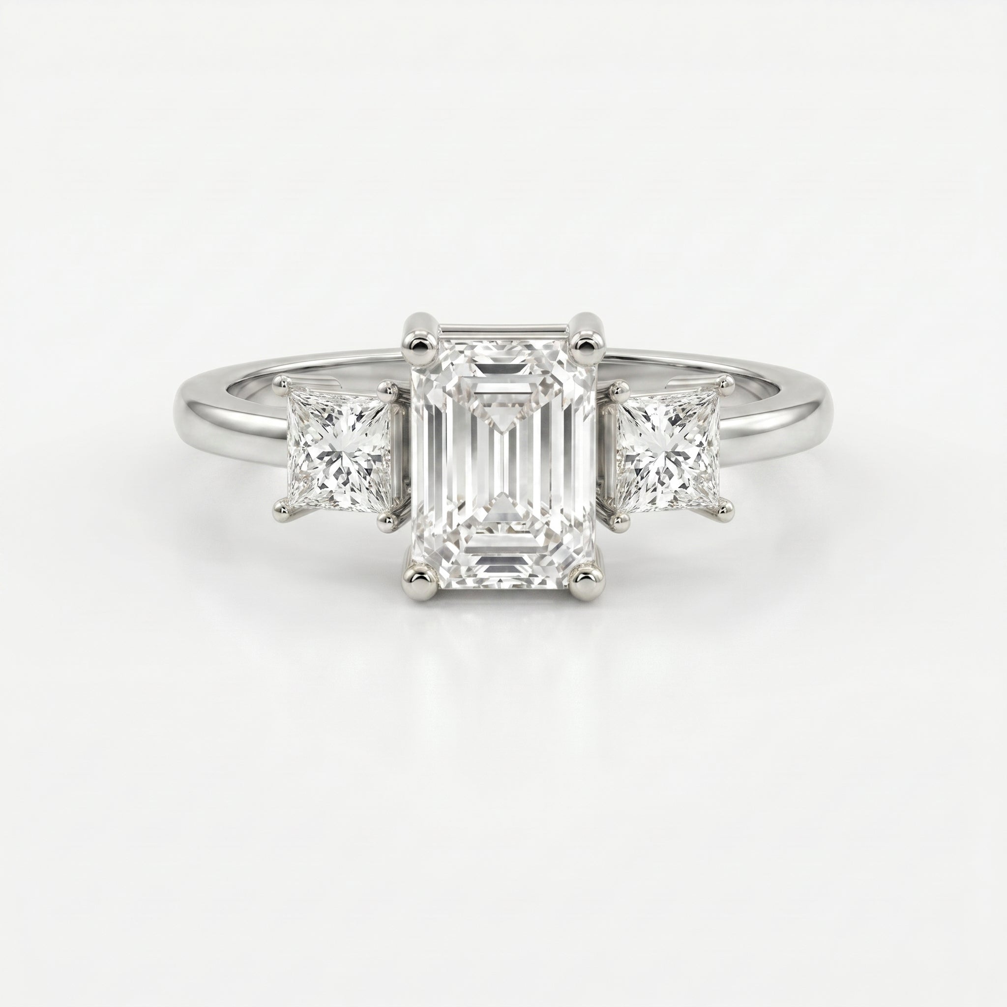 The Axis Trio Emerald Ring
