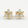 Luxury floral stud earrings flat lay with sparkling stones and minimalist premium jewelry styling