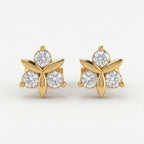 Luxury floral stud earrings flat lay with sparkling stones and minimalist premium jewelry styling