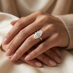 Luxury marquise diamond engagement ring worn on hand featuring a polished yellow gold band and timeless design.
