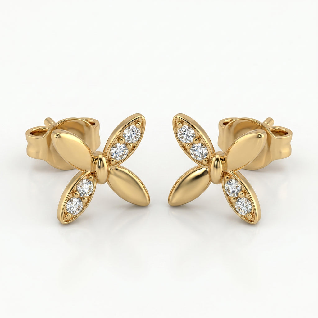 Macro close-up of pavé diamonds on butterfly stud earrings with high-polish luxury gold finish