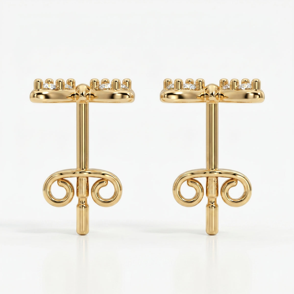 Macro close-up of pavé diamonds on butterfly stud earrings with high-polish luxury gold finish