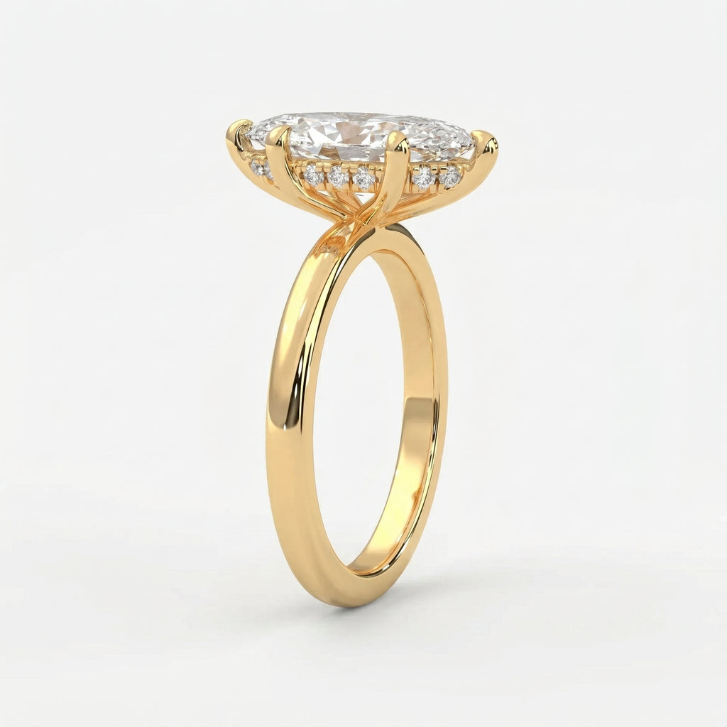 Marquise-cut diamond engagement ring in polished yellow gold with hidden halo setting and elegant cathedral profile