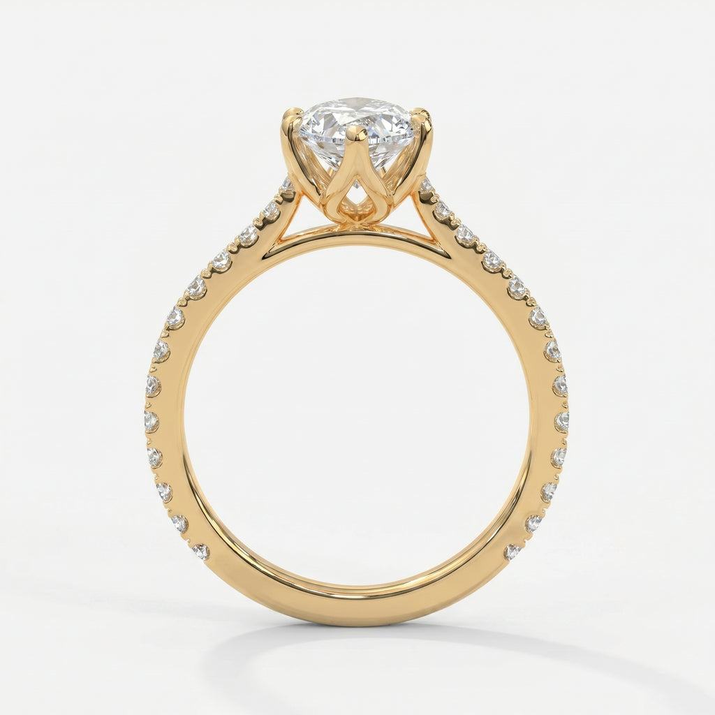 Side profile of marquise diamond engagement ring featuring cathedral setting and pavé diamond shoulders.