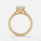 Side profile of marquise diamond engagement ring featuring cathedral setting and pavé diamond shoulders.